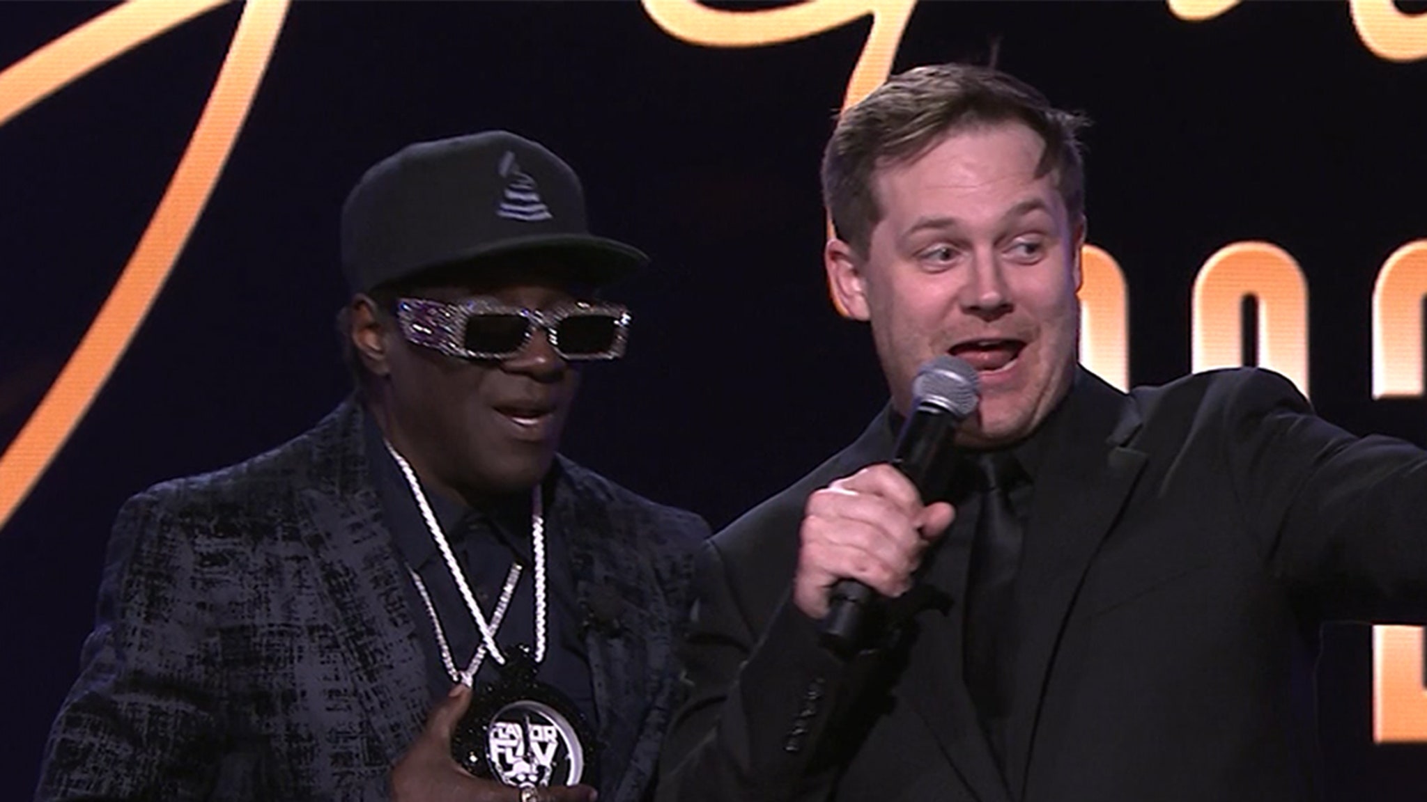 Flavor Flav Spontaneously Auctions Clock Off His Neck for ,000