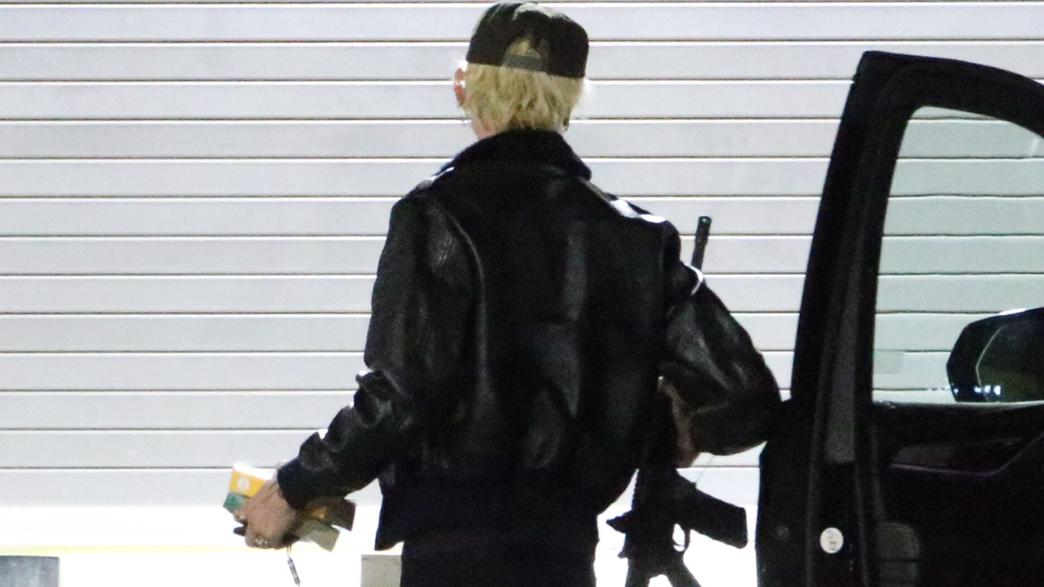 Assault Rifle in Studio: Machine Gun Kelly’s Bold Entrance